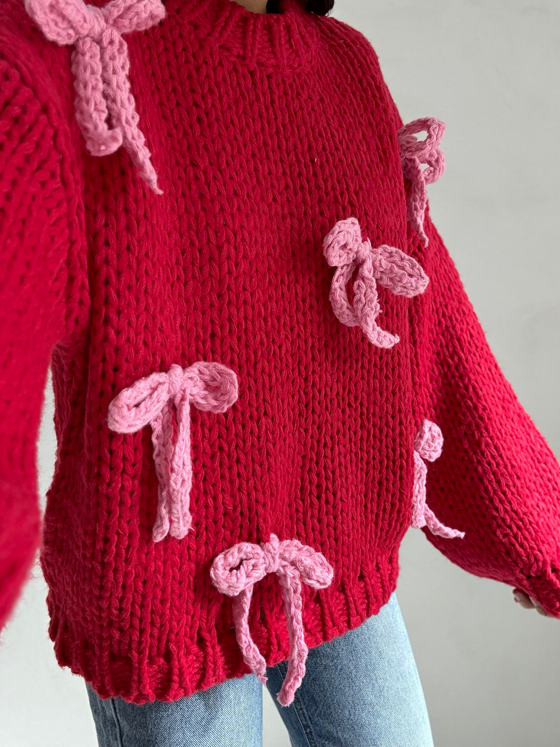 Maglione ‘UNCINETTO’ Rosso con fiocchi rosa